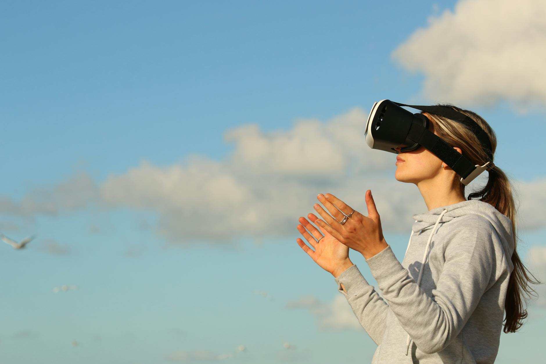 https://www.pexels.com/photo/woman-using-vr-goggles-outdoors-123335/